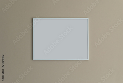 White frame on a beige wall copy space