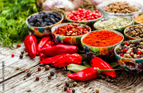 Fototapeta Naklejka Na Ścianę i Meble -  Set of Indian spices on wooden table - Top view