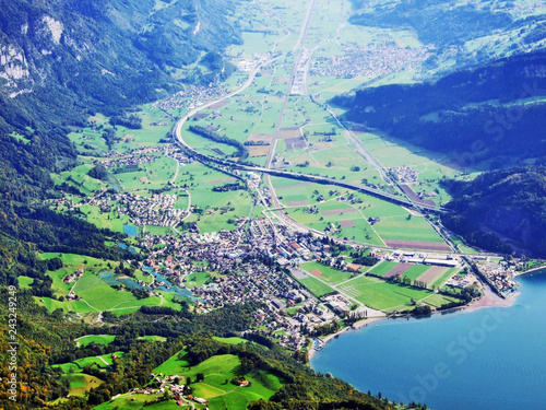 The town of Walenstadt on the shore of Lake Walensee and in the valley of Seez river or in the valley of Seeztal - Canton of St. Gallen, Switzerland photo