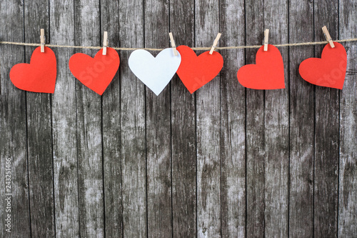 Valentine's hearts on a dark wooden background.