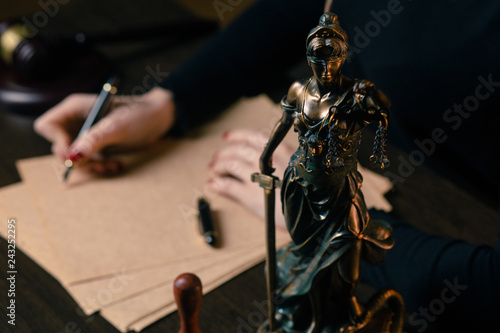 lawyer working with contract papers and wooden gavel on tabel in courtroom. justice and law ,attorney, court judge, concept. © burdun