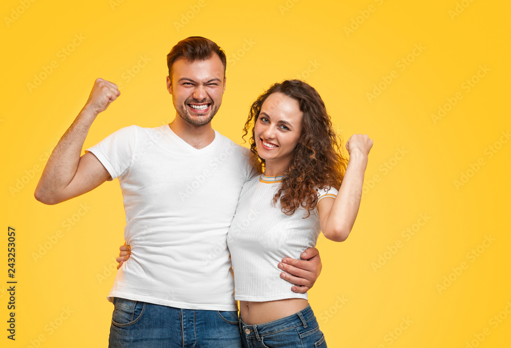 Cheerful couple hugging and gesturing Cheerful couple hugging and gesturing