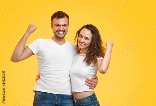 Cheerful couple hugging and gesturing