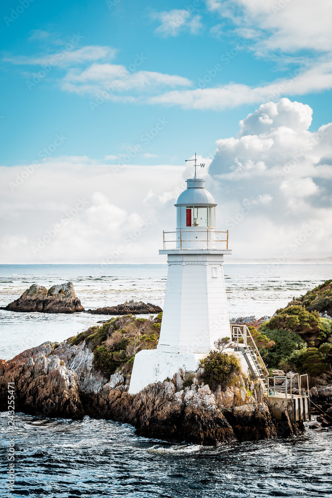 Lighthouse on Bonnet Island, Hells Gate, Macquarie Harbour in Western Tasmania, Australia Lighthouse on Bonnet Island, Hells Gate, Macquarie Harbour in Western Tasmania, Australia