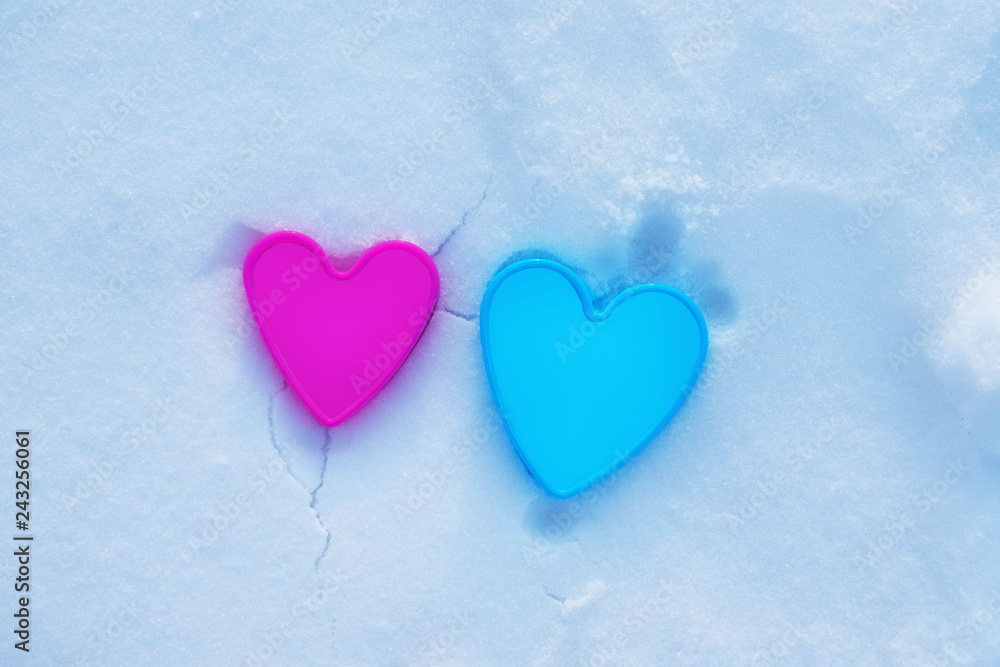image of two hearts in the snow