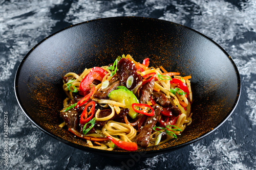 Udon noodles with vegetables, duck. The stir fry teriyaki beef