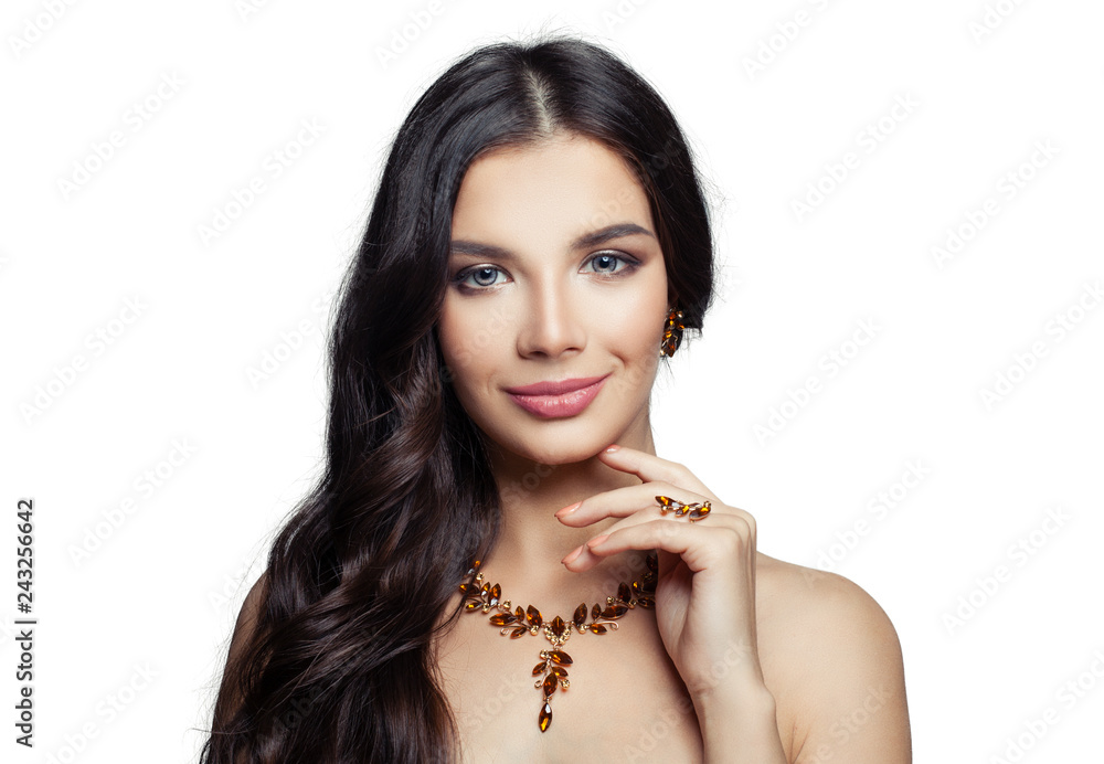 Glamorous woman with makeup, long hair and golden necklace and earrings portrait