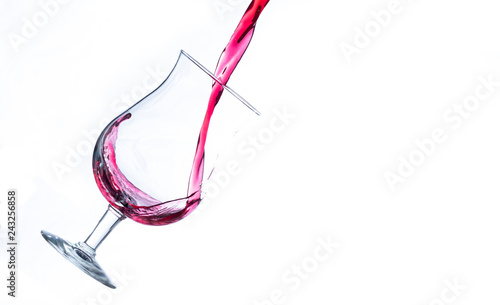 red wine pouring in a glass splash