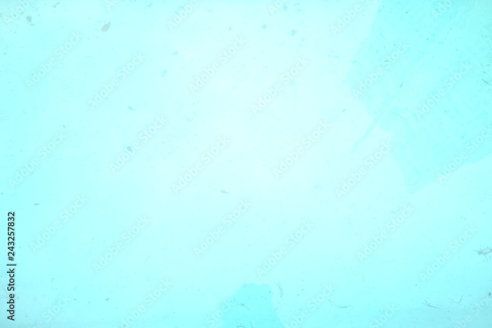Blurred water surface with blue color of a dirty pool for background texture 