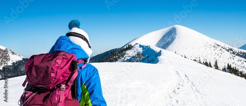 Woman on winter mountain symbol, Self confident woman in snowy mountains, Symbol winter experience panorama background