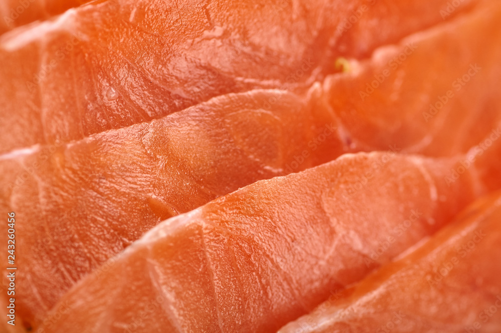 Expensive red fish close up. Edible fish texture for the substrate on the site. Living corals. Texture of fish, meat, bacon, jamon. Gentle pink shade. Expensive red fish close up. Edible fish texture for the substrate on the site. Living corals. Texture of fish, meat, bacon, jamon. Gentle pink shade.