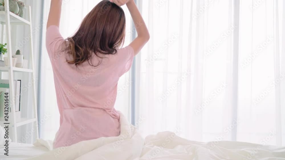 Young Asian women lesbian happy couple talking and drinking coffee in bedroom at home, enjoy love moment while lying on bed when relaxed in morning. Lifestyle LGBT couple together indoors concept. Young Asian women lesbian happy couple talking and drinking coffee in bedroom at home, enjoy love moment while lying on bed when relaxed in morning. Lifestyle LGBT couple together indoors concept.