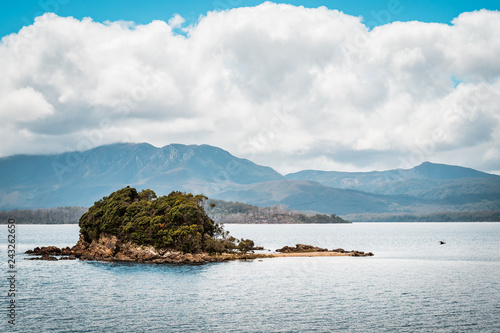 Tasmania, Australia on an Idyllic morning on the Gordon River, we'll take a cruise with great scenery and beautiful reflections in the water near the town of Strahan, on board of a highspeed catamaran