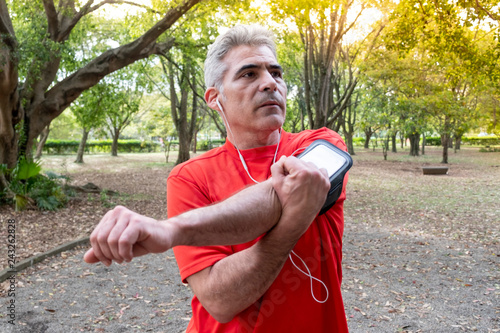 An older Brazilian man exercising in a local park