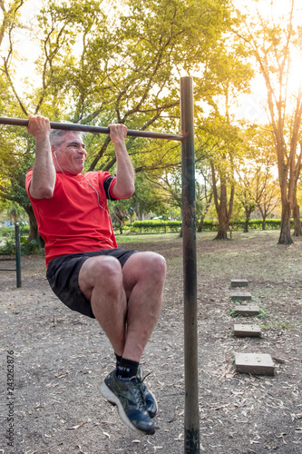 An older Brazilian man exercising in a local park