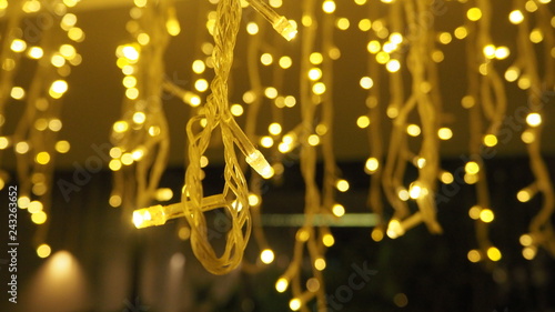 Bokeh images circle bubbles shape yellow color of little LED Light bulb  in the night.