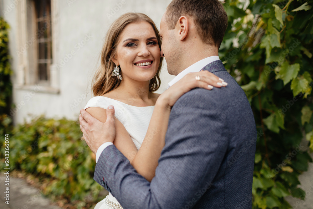 Fototapeta premium Wedding couple. Pretty bride and stylish groom.