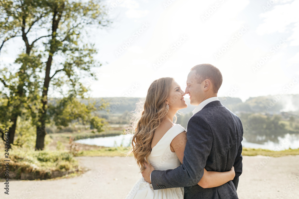 Obraz premium Wedding couple. Pretty bride and stylish groom.