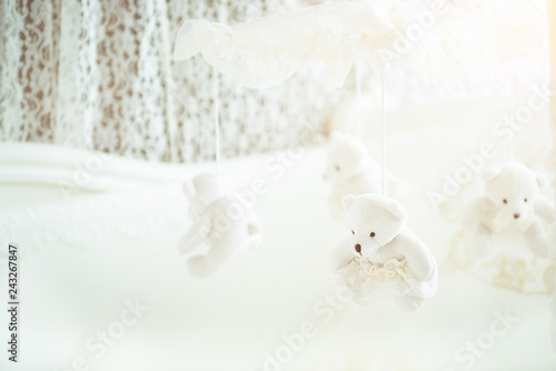 White baby cot for newborn with hanging bears