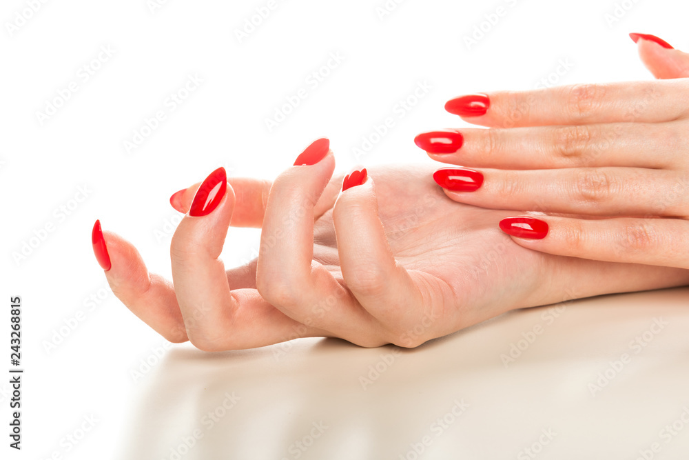 Woman hands with manicured red nails Woman hands with manicured red nails