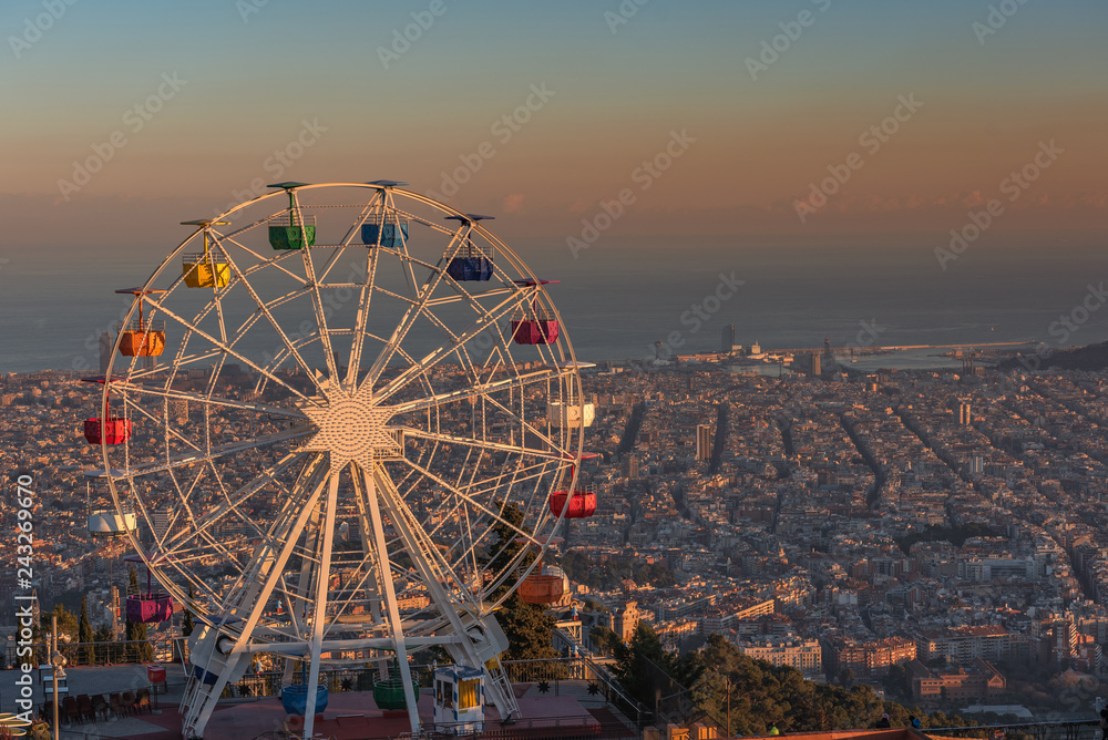 Ferris wheel on Tibidabo hill Barcelona at sunset
