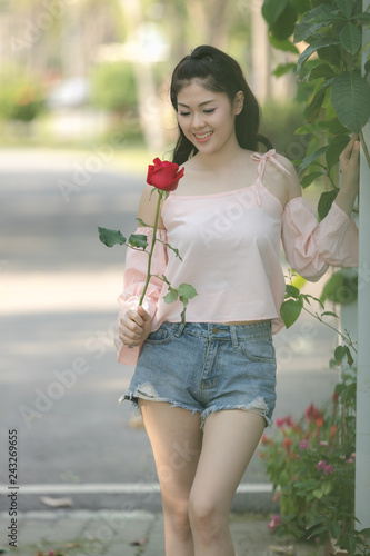 yooung asian girl with rose valentine concept photo