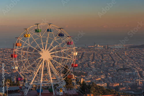 Ferris wheel on Tibidabo hill Barcelona at sunset