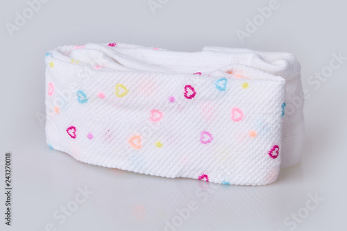 New hearts patterned folded child's tights isolated on white