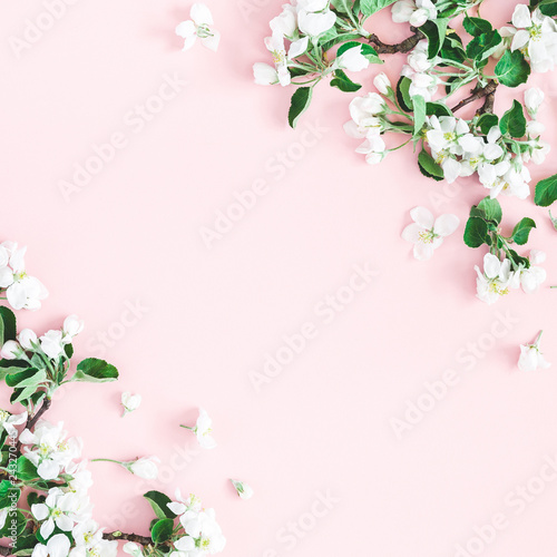 Flowers composition. Apple tree flowers on pastel pink background. Spring concept. Flat lay, top view, copy space, square