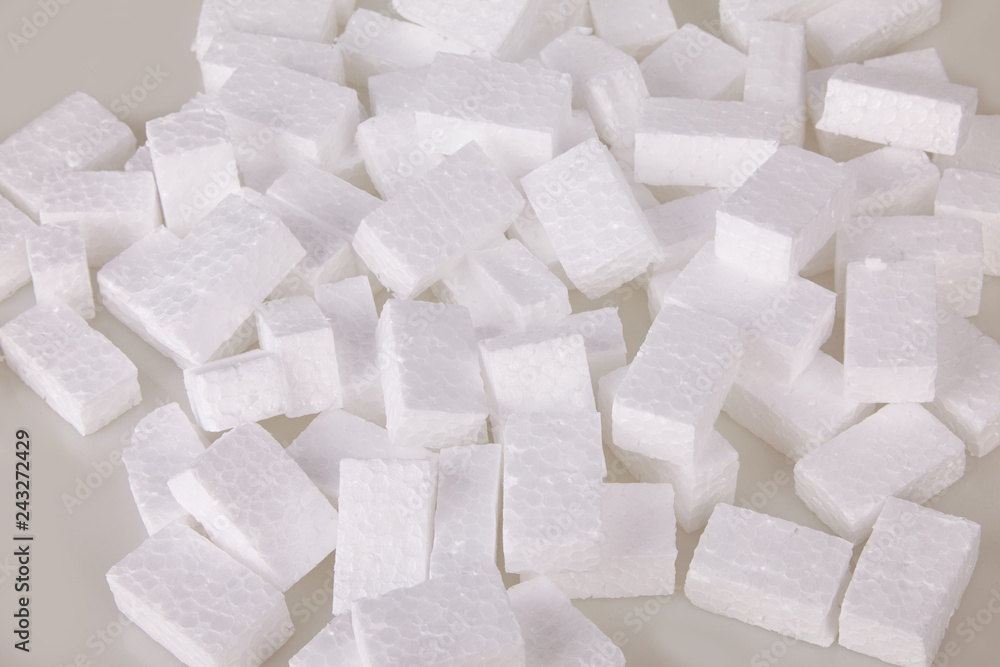 Filler packing background. Packaging foam pellets texture, top view, closeup. Polystyrene