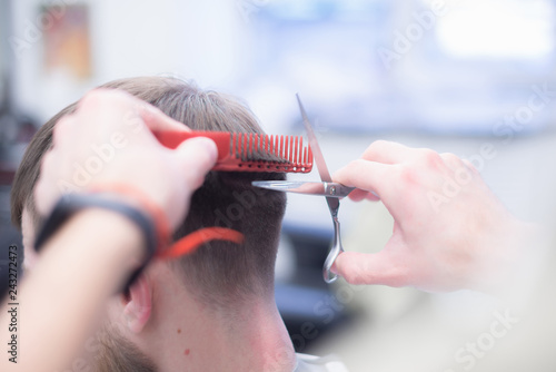 Men's haircut in barbershop. Hair Care. Great plan.