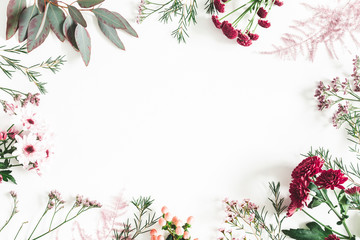 Flowers composition. Eucalyptus leaves and pink flowers on white background. Flat lay, top view