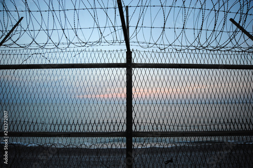 Military Barbed wire, installed on the seaside.