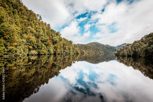 Obraz na płótnie Natural reflections, mirror effect on the water in the beautiful wilderness of Tasmania, Gordon River near Strahan, Australia w salonie