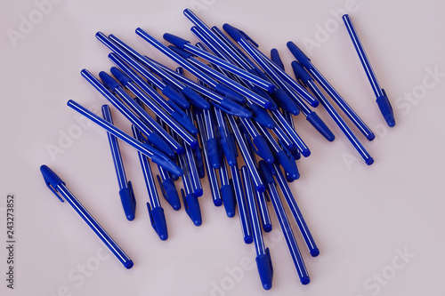Blue plastic pens isolated on white