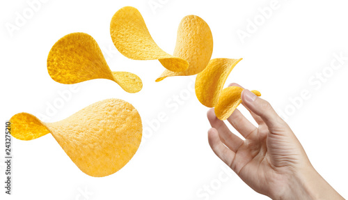 Hand throwing potato chips, isolated on white background photo