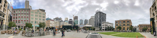 AUCKLAND, NEW ZEALAND - AUGUST 26, 2018: City skyline from Britomart, panoramic view on a cloudy afternoon photo