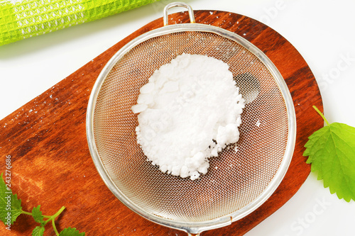 Powdered sugar in a sieve