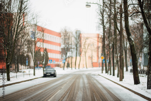 frosty winter morning, snowy empty street, winter city without people