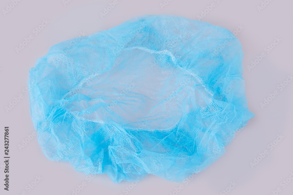 Blue medical disposable cap isolated on white