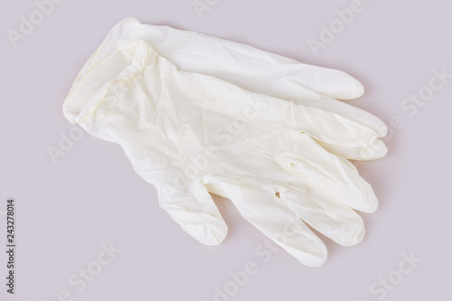 White latex medical gloves on white background © Liudmila