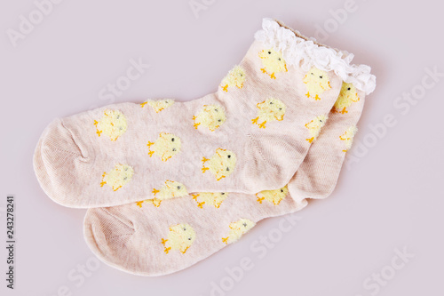 Pair of socks with chicken pattern on the white background. Child's  socks