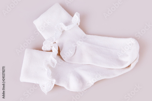 Pair white girl's of socks on the white background.  Child's  socks