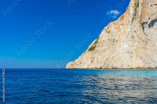 Greece, Zakynthos, Huge white cliff and beautiful blue ocean water at island coast