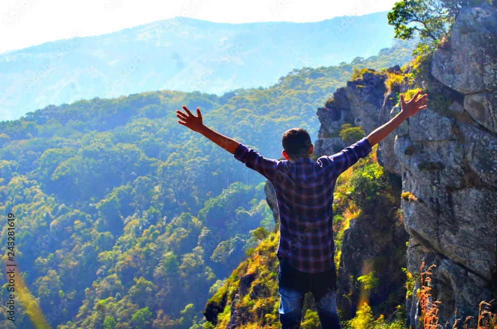 Obraz premium man on top of mountain