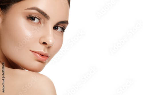The beautiful female face. The perfect and clean skin of face on white