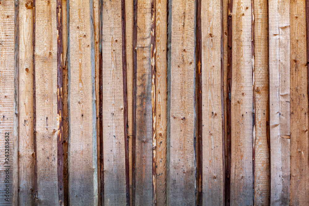 Rough fence made of pine planks. Rough fence made of pine planks.