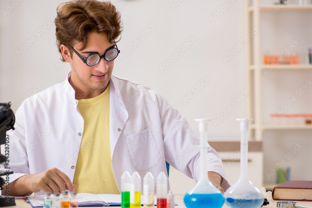 Funny crazy chemist doing experiments and tests Funny crazy chemist doing experiments and tests