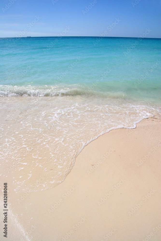 Beautiful white sand beach with turquoise sea & blue sky, Aruba