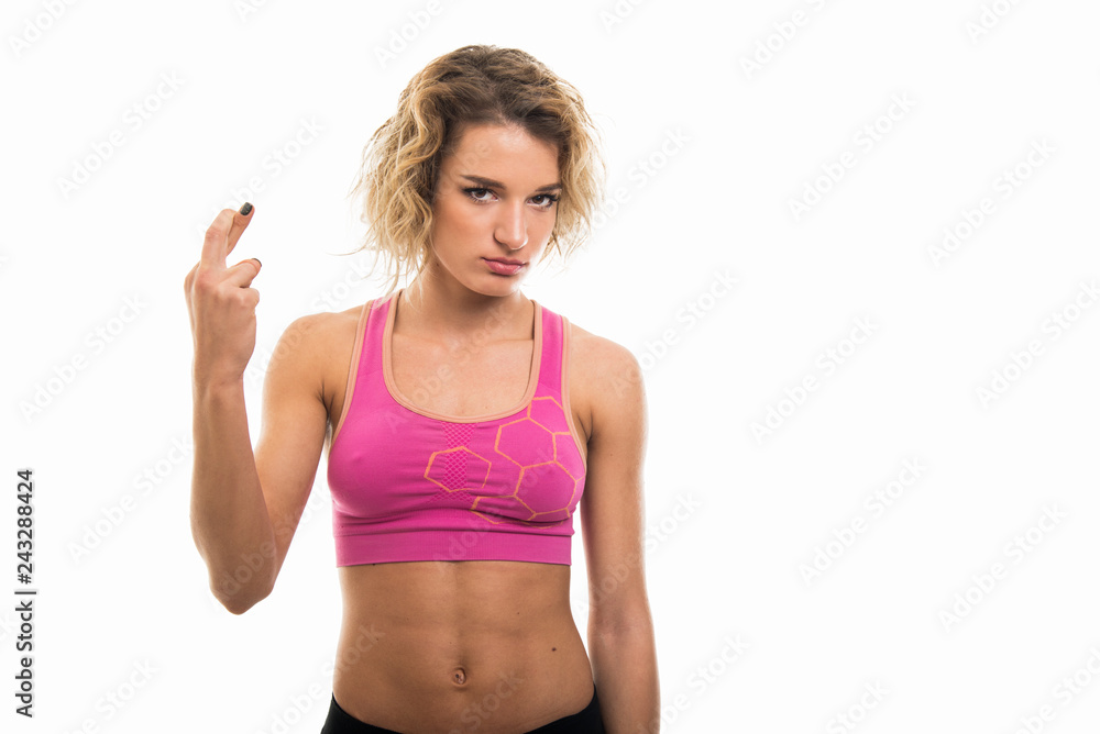 Portrait of beautiful young fit girl holding fingers crossed Portrait of beautiful young fit girl holding fingers crossed